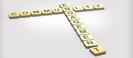 scrabble tiles spelling out the words community engagement